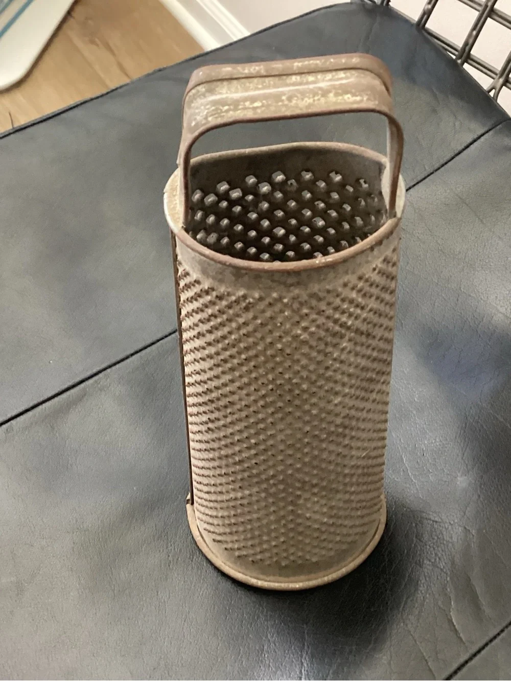 Antique Primitive small round metal tin cylinder grater. Most often used for